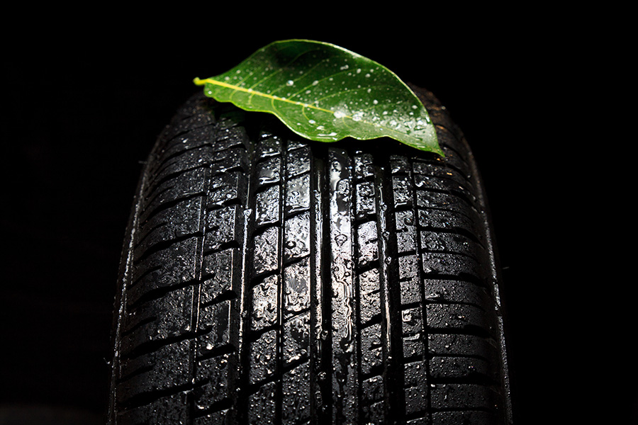 All season tire with leaf and rain droplets